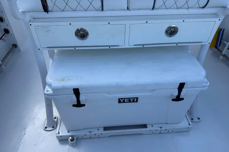 Slide: The Image of 2022 Sportsman Open 232 Center Console with Yeti cooler and storage drawers. - 58