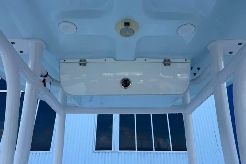 Slide: The Image of 2022 Sportsman Open 232 Center Console T-top with storage compartment and lighting. - 59