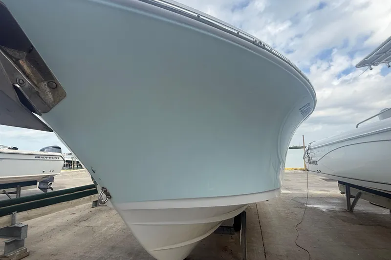 Slide: The Image of 2022 Sportsman Open 232 Center Console boat on a trailer, viewed from the front. - 6
