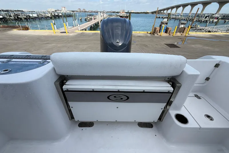 Slide: The Image of 2022 Sportsman Open 232 Center Console boat at dock with scenic waterfront view. - 69