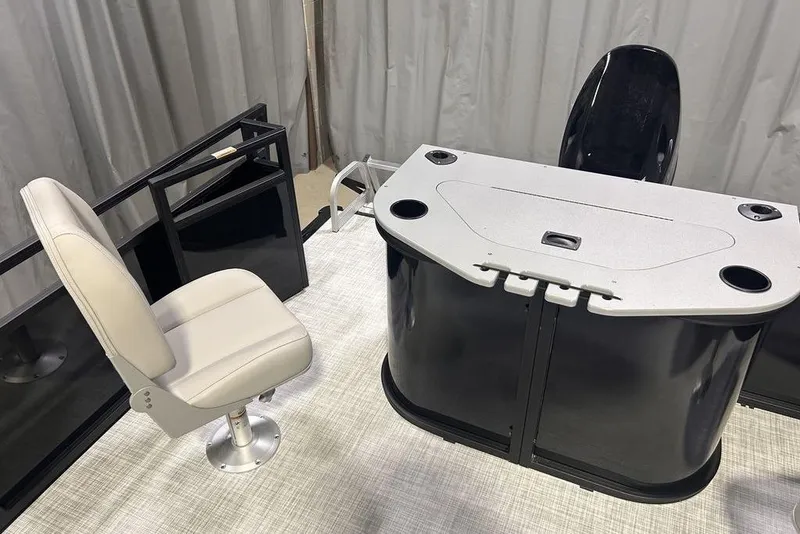 Slide: The Image of 2026 Dockside 22DF boat interior with swivel chair and control console. - 3