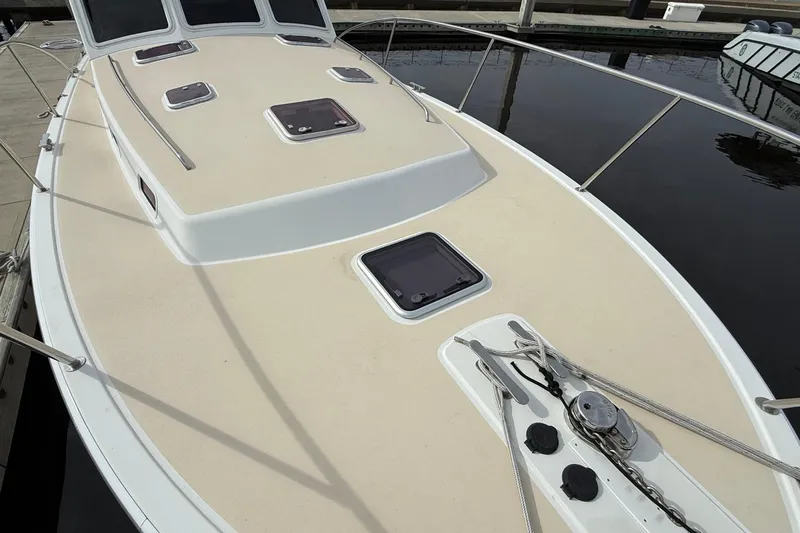Slide: The Image of 2012 MJM 40z yacht deck with hatches and railing, docked at marina. - 10