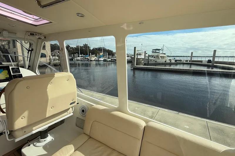 Slide: The Image of Interior view of 2012 MJM 40z yacht overlooking marina with boats. - 19