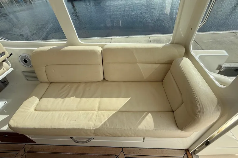 Slide: The Image of Cream-colored seating on a 2012 MJM 40z boat, with a view of the water. - 20