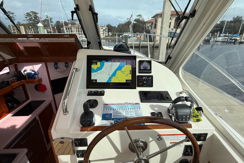 Slide: The Image of Interior view of 2012 MJM 40z yacht cockpit with navigation equipment and steering wheel. - 27