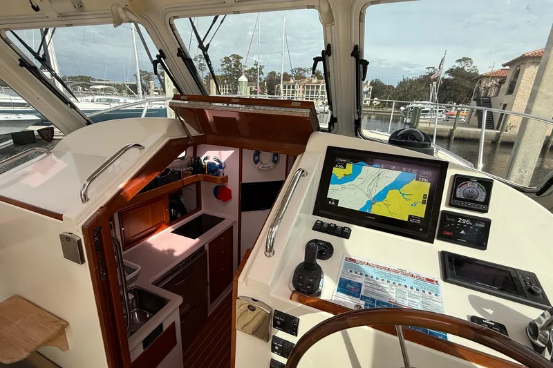 Slide: The Image of Interior view of a 2012 MJM 40z yacht cockpit with navigation equipment and controls. - 28