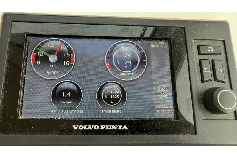 Slide: The Image of Volvo Penta display showing voltage, fuel level, fuel economy, and engine hours on MJM 40z 2012. - 29