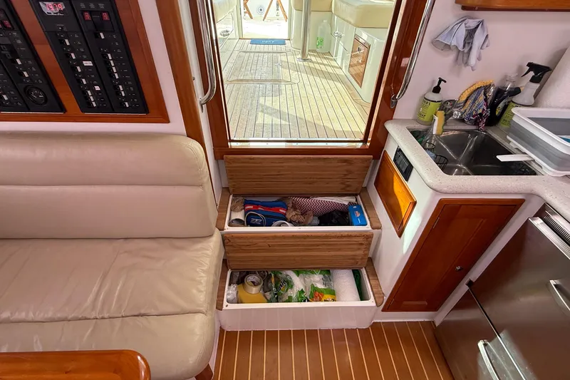 Slide: The Image of Interior of 2012 MJM 40z yacht with storage drawers and kitchenette area. - 31