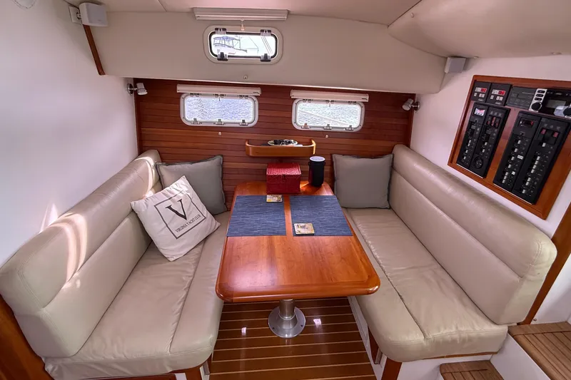 Slide: The Image of Luxurious interior of 2012 MJM 40z yacht with cozy seating and wooden table. - 34