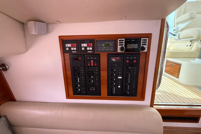 Slide: The Image of Control panel inside 2012 MJM 40z yacht, featuring various switches and displays. - 35