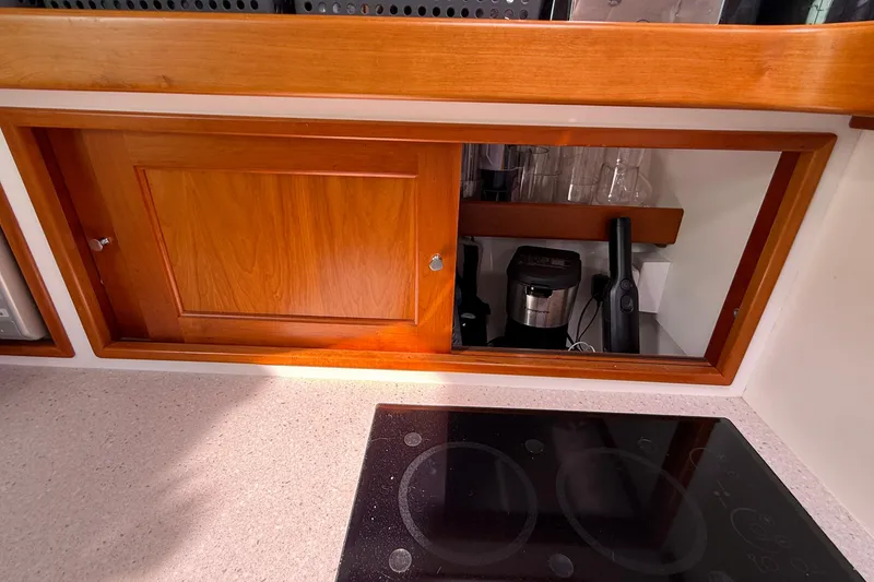 Slide: The Image of Wooden cabinet and electric stove in 2012 MJM 40z yacht kitchen. - 38