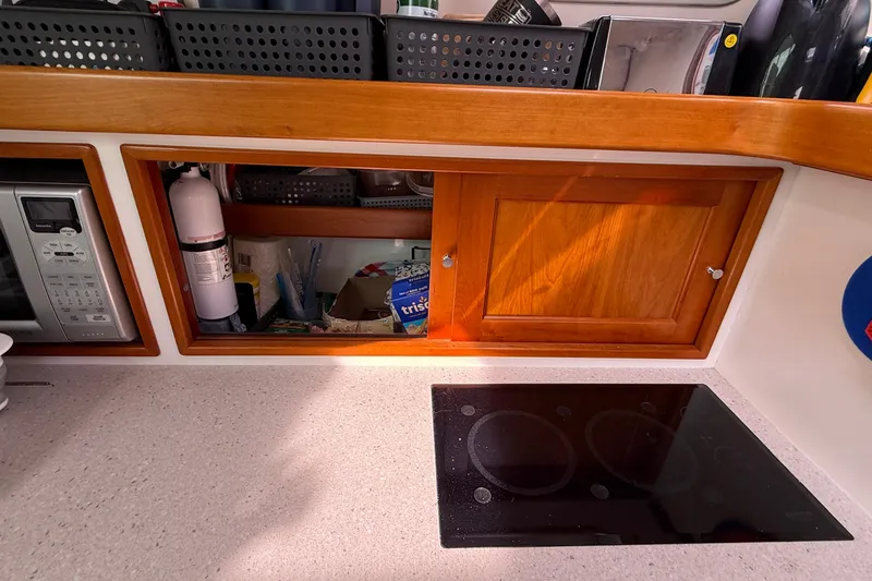 Slide: The Image of Kitchen area of 2012 MJM 40z yacht with stove, microwave, and storage. - 39