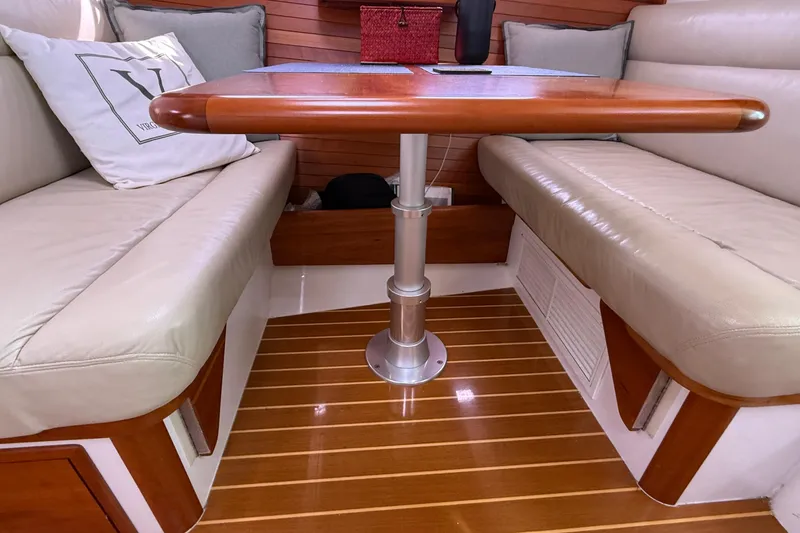 Slide: The Image of Interior of 2012 MJM 40z yacht with wooden table and leather seating. - 44