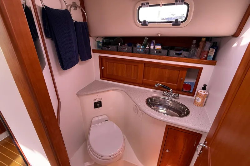 Slide: The Image of Luxurious 2012 MJM 40z yacht bathroom with sink, toilet, and wooden cabinetry. - 47