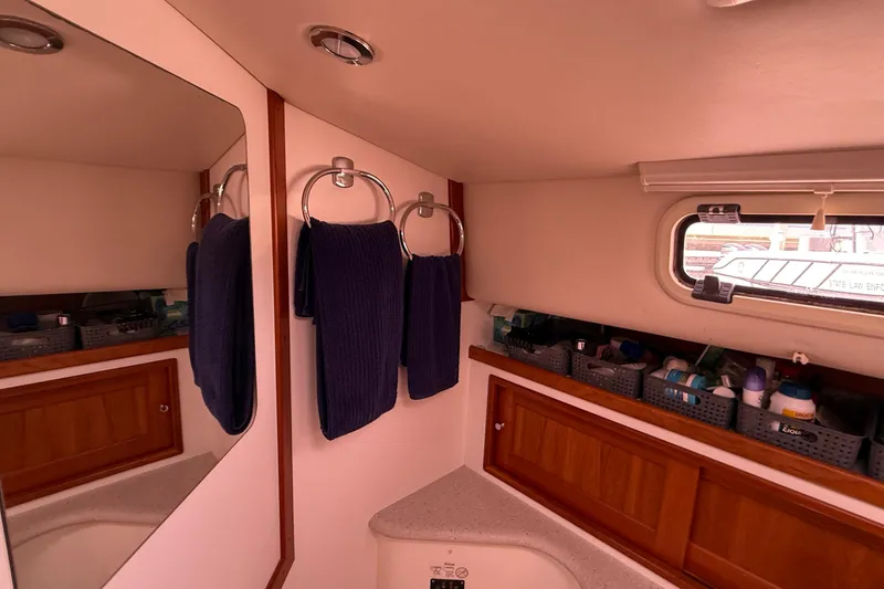 Slide: The Image of Interior of 2012 MJM 40z yacht bathroom with towels and storage baskets. - 49