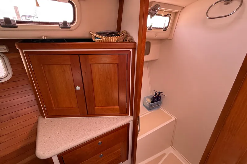 Slide: The Image of Interior of 2012 MJM 40z yacht featuring wooden cabinetry and compact bathroom space. - 53