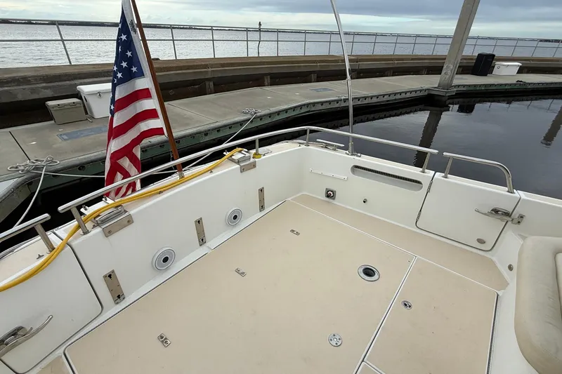 Slide: The Image of 2012 MJM 40z boat deck with American flag at marina. - 59