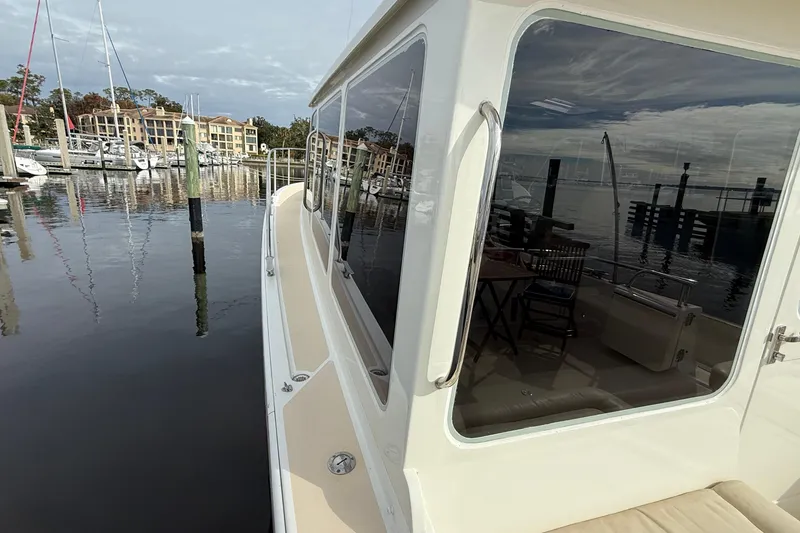 Slide: The Image of 2012 MJM 40z yacht docked at marina with waterfront view. - 8