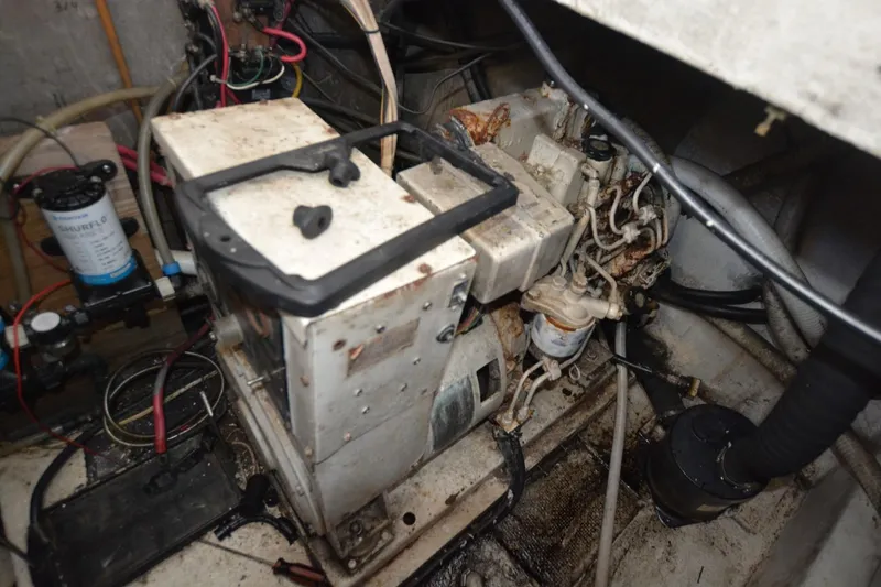 Slide: The Image of Engine room of 1983 Key West #1 Sport Fish boat, showing machinery and wiring. - 18