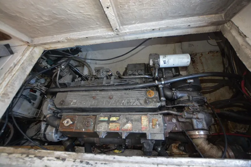 Slide: The Image of Engine compartment of a 1983 Key West #1 Sport Fish boat, showing detailed machinery. - 19