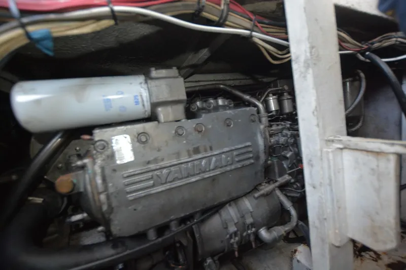 Slide: The Image of Engine compartment of 1983 Key West #1 Sport Fish boat, featuring Yanmar engine. - 21