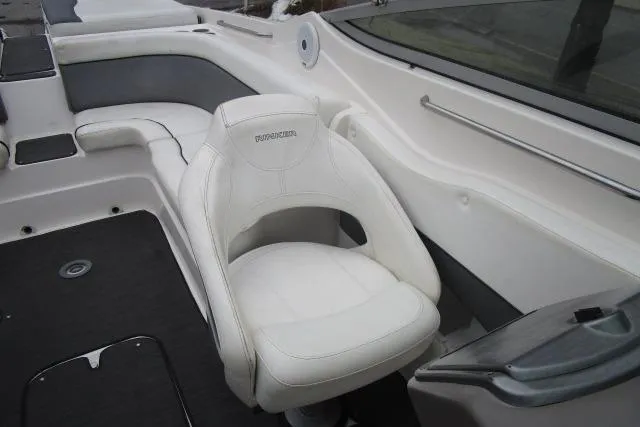 Slide: The Image of 2009 Rinker 276 Captiva Bowrider interior with white seating and sleek design. - 10