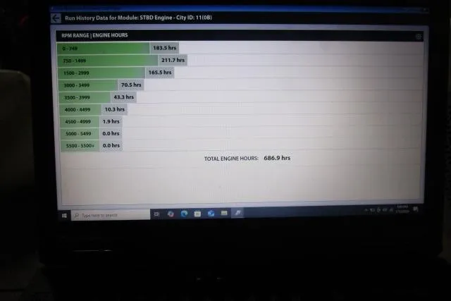 Slide: The Image of Engine run history data on laptop screen for 2009 Rinker 276 Captiva Bowrider. - 17