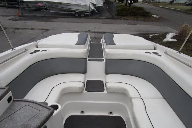 Slide: The Image of 2009 Rinker 276 Captiva Bowrider interior with gray and white seating. - 6