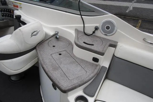 Slide: The Image of 2009 Rinker 276 Captiva Bowrider interior with seating and control panel. - 7