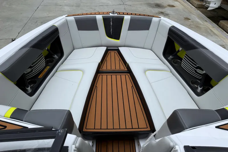 Slide: The Image of 2015 Nautique Super Air Nautique G23 Coastal Edition interior with sleek seating and wood accents. - 7