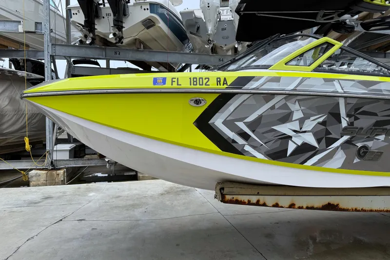 Slide: The Image of 2015 Nautique Super Air Nautique G23 Coastal Edition in vibrant yellow and gray design. - 9
