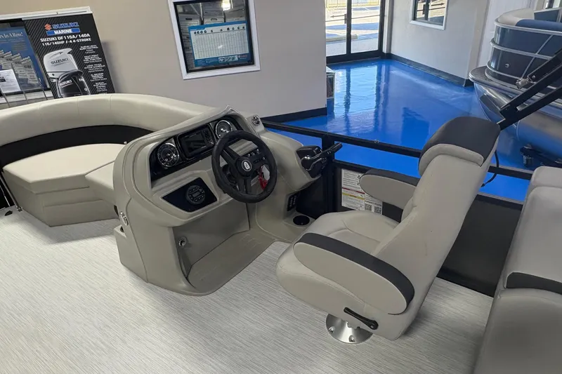 Slide: The Image of Interior of 2026 Dockside 22DQ boat with steering console and seating. - 7