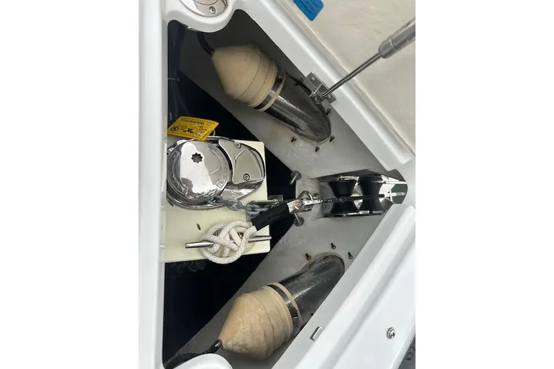 Slide: The Image of 2016 Cobalt A28 boat anchor compartment with winch and fenders. - 12