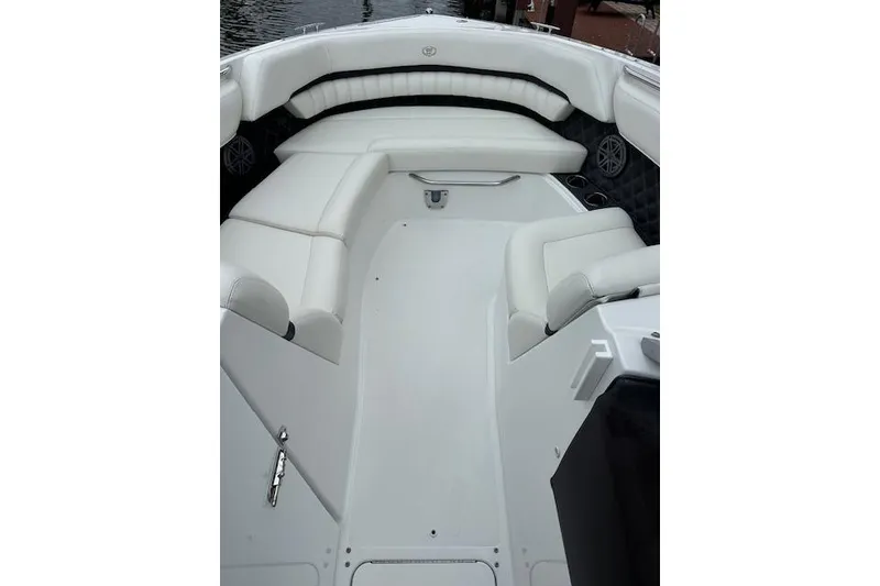 Slide: The Image of 2016 Cobalt A28 boat interior with white seating and sleek design. - 13