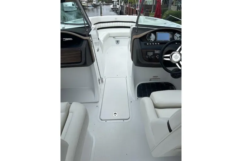 Slide: The Image of 2016 Cobalt A28 boat interior with steering wheel and dashboard controls. - 34