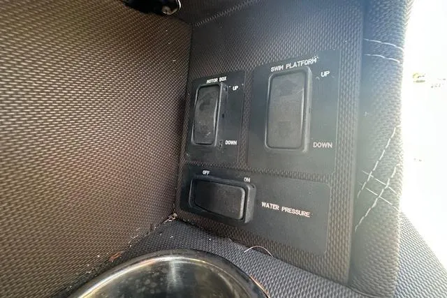 Slide: The Image of Control panel of a 2016 Cobalt A28 boat with switches for motor box and swim platform. - 50