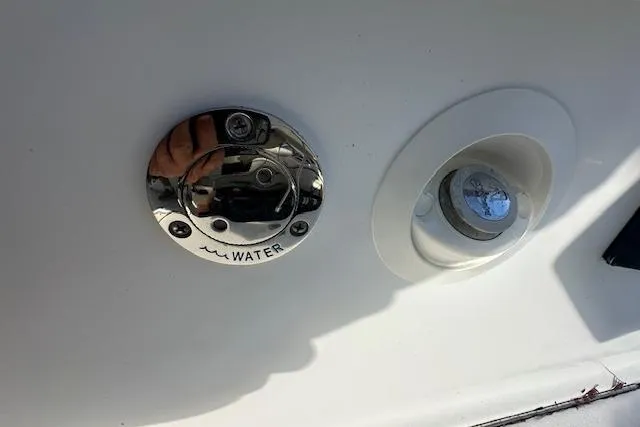 Slide: The Image of Water inlet and light fixture on 2016 Cobalt A28 boat. - 53