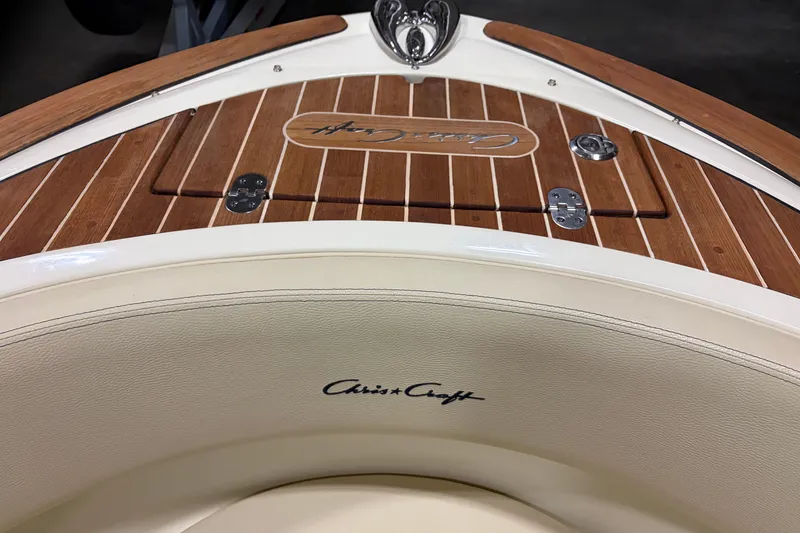 Slide: The Image of 2020 Chris-Craft Launch 28 GT boat with teak wood deck and logo detail. - 11