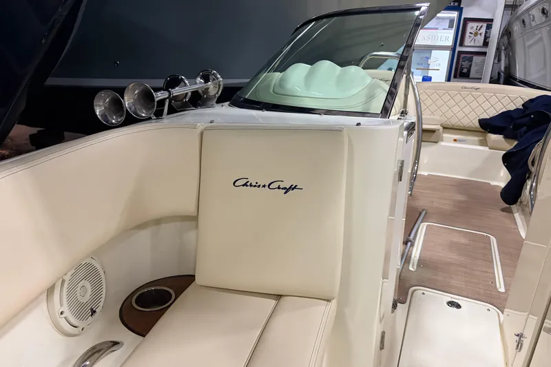 Slide: The Image of 2020 Chris-Craft Launch 28 GT interior with cream upholstery and wood accents. - 12