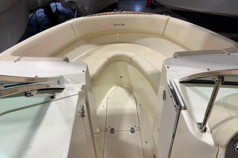 Slide: The Image of 2020 Chris-Craft Launch 28 GT boat interior with cream seating and sleek design. - 14
