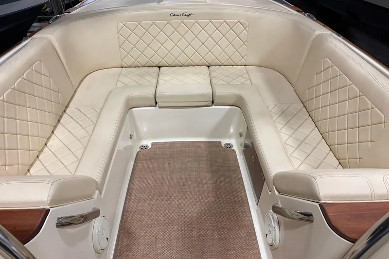 Slide: The Image of Luxurious interior of 2020 Chris-Craft Launch 28 GT with beige diamond-stitched seating. - 15