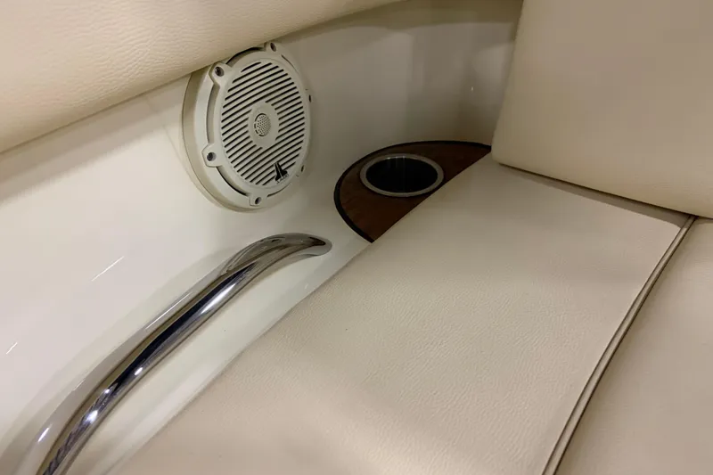 Slide: The Image of 2020 Chris-Craft Launch 28 GT interior with speaker, cup holder, and handrail. - 17