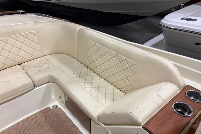 Slide: The Image of Luxurious seating on 2020 Chris-Craft Launch 28 GT boat with quilted upholstery and cup holders. - 19