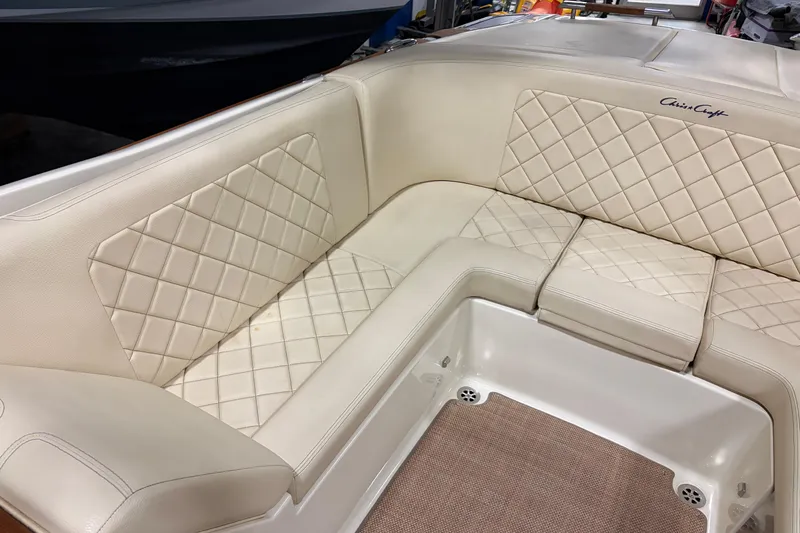 Slide: The Image of 2020 Chris-Craft Launch 28 GT boat interior with beige quilted seating. - 25