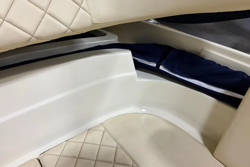 Slide: The Image of 2020 Chris-Craft Launch 28 GT interior with quilted seating and storage compartment. - 28