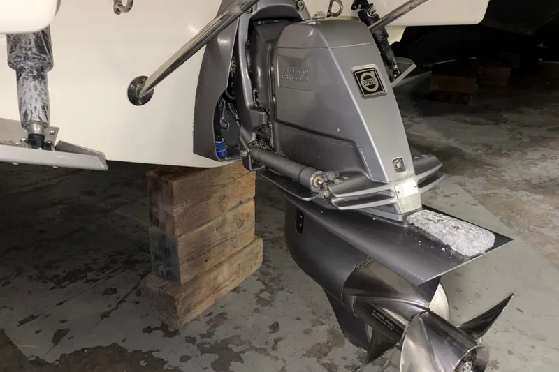 Slide: The Image of 2020 Chris-Craft Launch 28 GT boat engine on wooden blocks in a garage. - 33