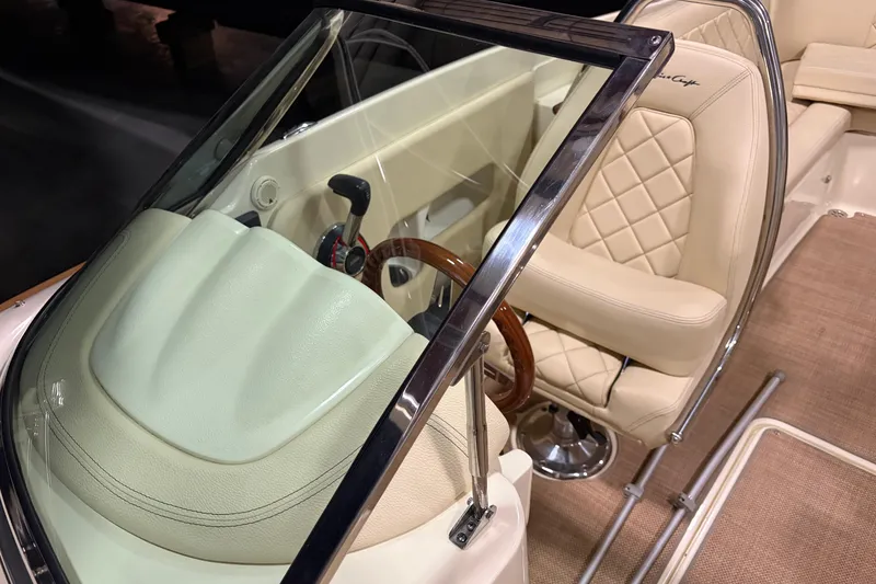 Slide: The Image of 2020 Chris-Craft Launch 28 GT interior with leather seats and wooden steering wheel. - 5