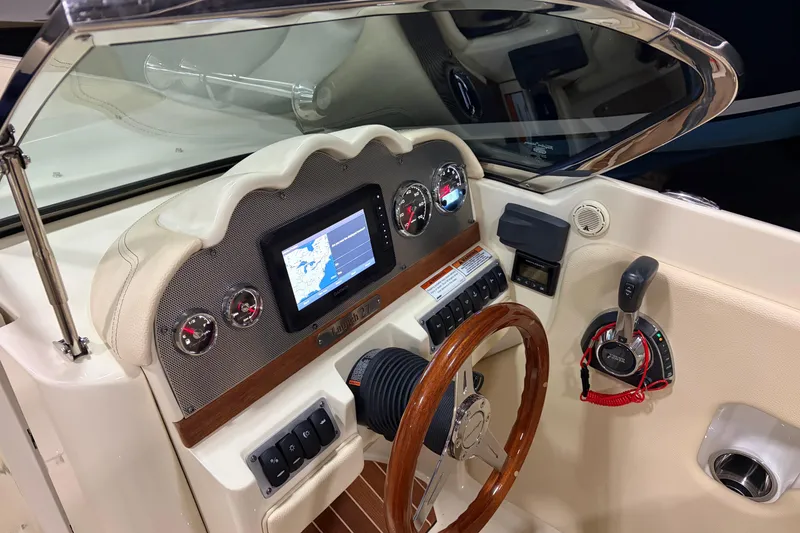 Slide: The Image of 2020 Chris-Craft Launch 28 GT dashboard with navigation screen and controls. - 7