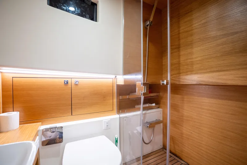 Slide: The Image of Luxurious bathroom interior of 2023 De Antonio Yachts D42 Open with wood accents and modern fixtures. - 17
