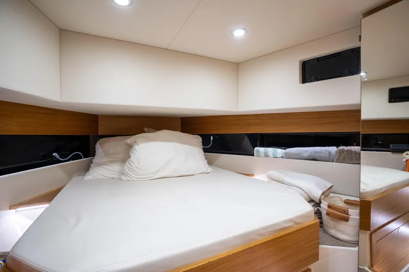 Slide: The Image of Luxurious cabin interior of 2023 De Antonio Yachts D42 Open, featuring a cozy bed and modern design. - 19